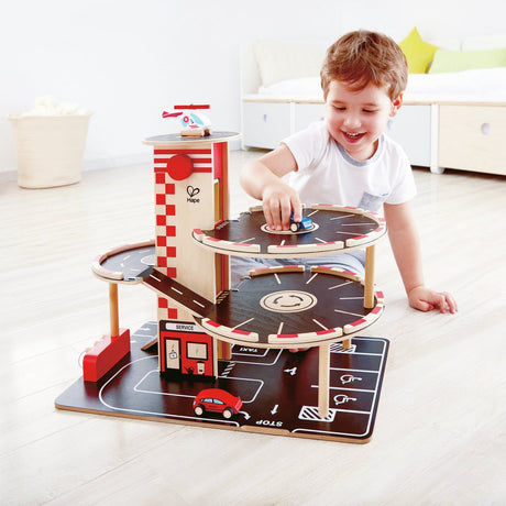 Hape Park Go Garage – Spielzeugparkhaus mit Aufzug, Helikopter und Autos, ab 3 Jahren