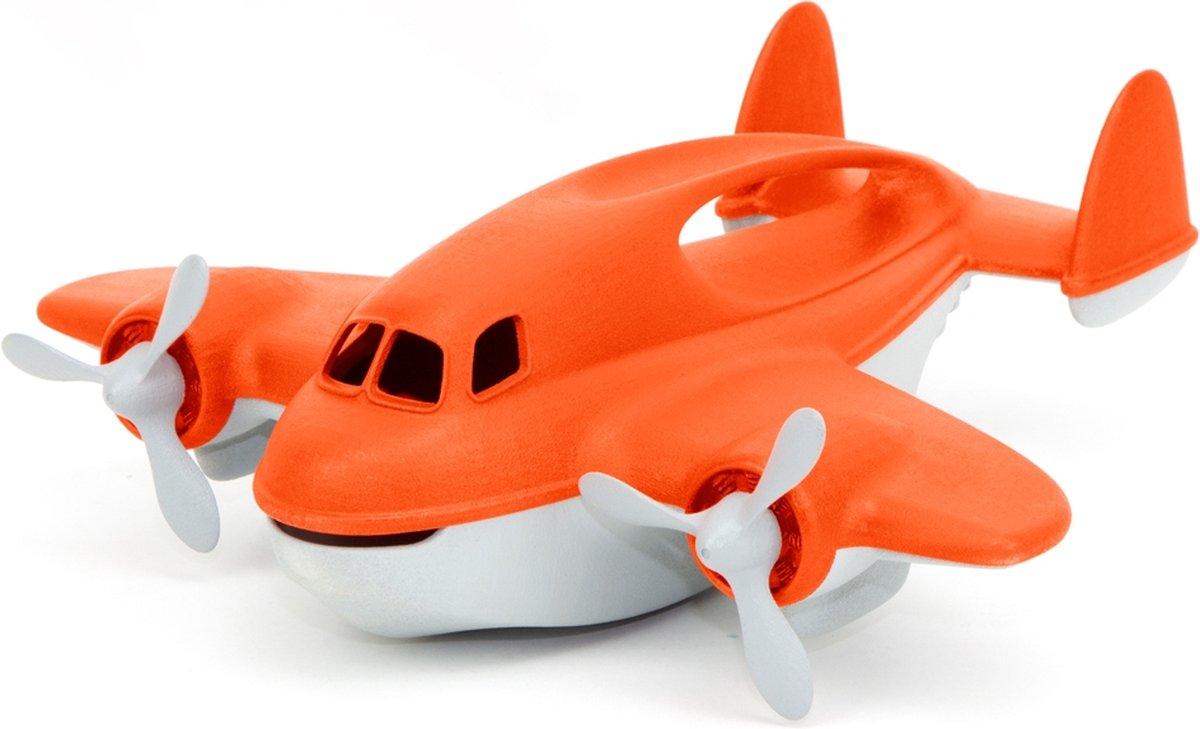 Grünes Spielzeug, orangefarbenes Löschflugzeug