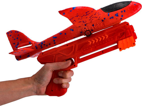 Toi-Toys schießt Schaumstoffflugzeug