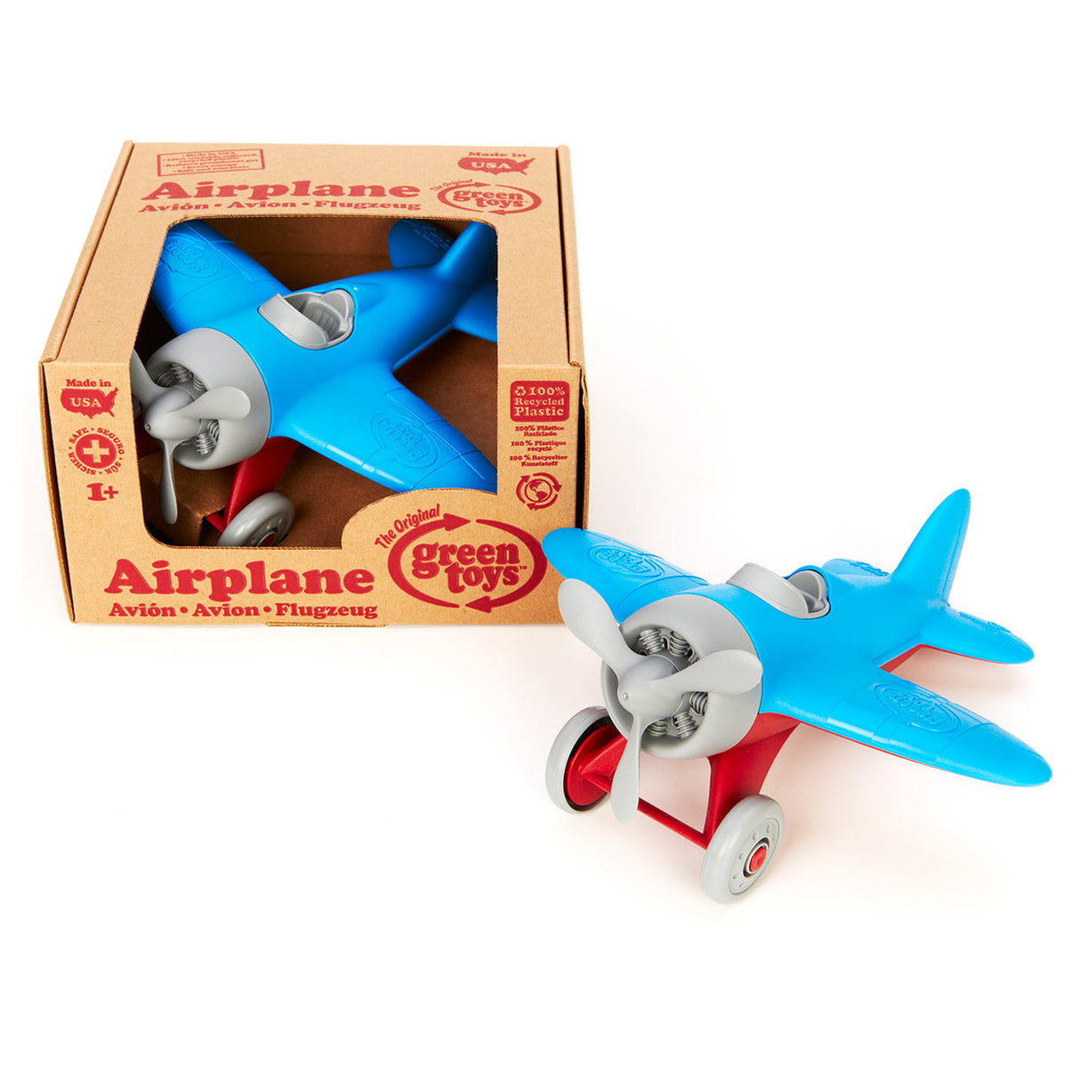 Grünes Spielzeugflugzeug - blau