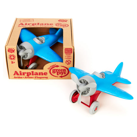 Grünes Spielzeugflugzeug - blau