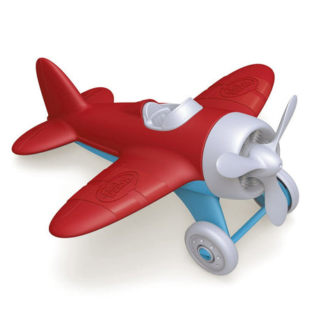 Grünes Spielzeugflugzeug - rot