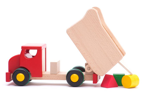 Bajo-Muldenkipper aus Holz mit roten Blöcken.