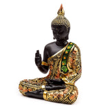 Schwarz-orangefarbene thailändische Buddha-Meditation