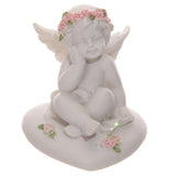 Cherubim rosa Rosen, sitzt auf dem Herzen