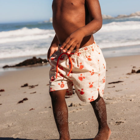 mürrisch | Beige rote UV-Badehose Jungen