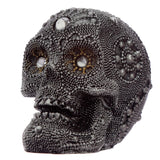Kleines silberfarbenes Totenkopf-Wohnaccessoire aus Perlen