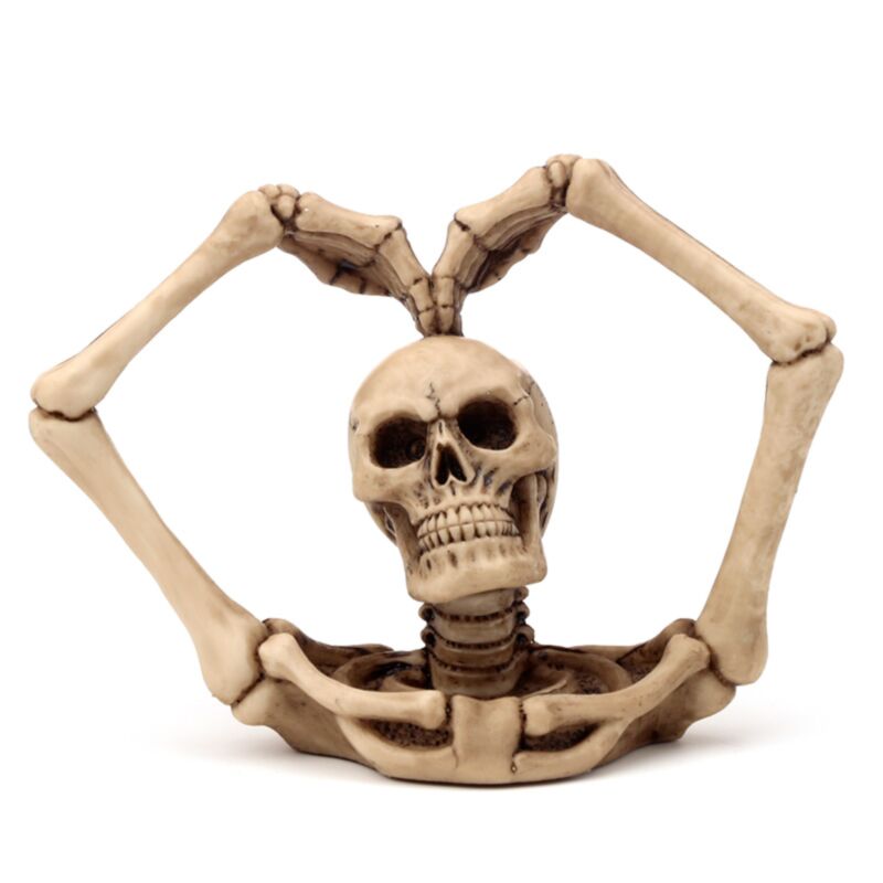 Wohnaccessoire mit Totenkopf und Skelettarmen, Herz
