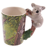 Weißer Keramikbecher mit koalaförmigem Henkel